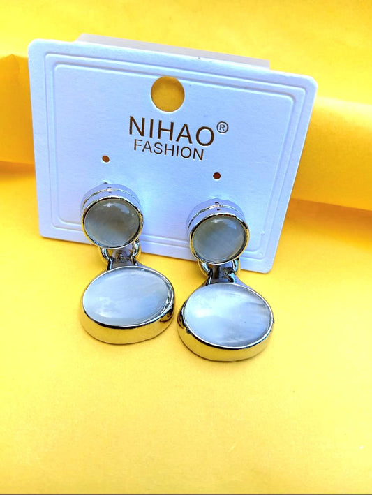 White studs earrings
