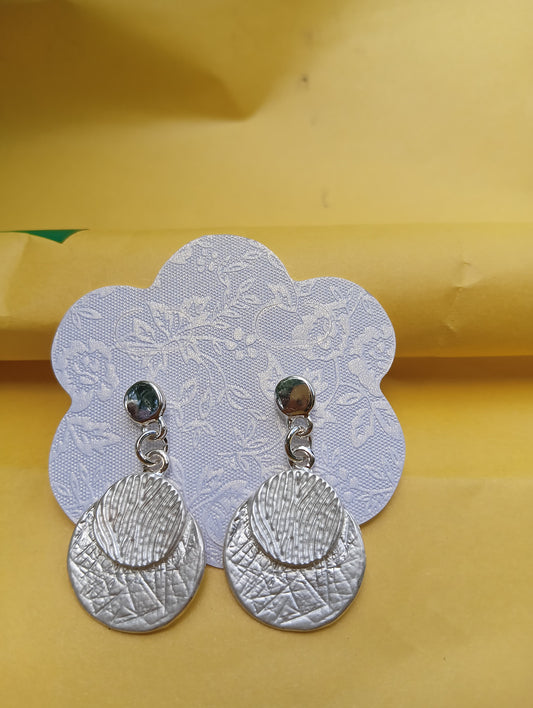 Silver tone filigree design earrings
